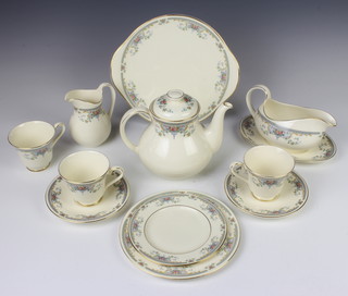 A Royal Doulton Juliet tea and dinner service comprising 8 tea cups, 8 saucers, 8 small plates, 8 medium plates, 8 large plates, 2 serving plates, teapot, milk mug, sauce boat and stand and 6 soup bowls