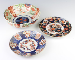 A 19th Century Imari scalloped dish decorated with a vases of flowers 21cm, a ditto dish 21cm and a deep bowl 25cm  