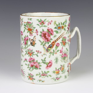 An 18th Century famille rose mug decorated with birds amongst flowers with an entwined handle 15cm 