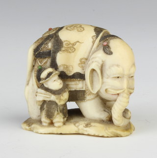 A Meiji period Japanese carved ivory and shibayama Netsuke in the form of a man standing beside an elephant, signed, 3cm 