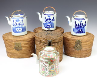 A Cantonese teapot decorated with figures and flowers with recess lid in a fitted wicker case, 3 Provincial blue and white ditto 