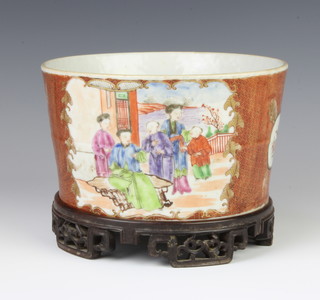 An unusual Mandarin palette porcelain Brush-washer or Cache-pot, c.1770, the slightly-flared body with panels of figures reserved on iron-red under a black diaper ground, 15cm, carved wood stand  (2) 