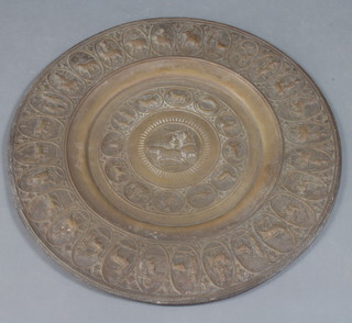 An Eastern embossed brass charger decorated a chariot scene and signs of the zodiac surrounded by 28 oval panels decorated figures and animals 62cm 