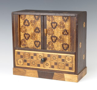 A Japanese inlaid marquetry cabinet, the upper section with tambour shutter revealing 2 long drawers (1f), the base fitted 1 long drawer 23cm x 24cm x 10cm 