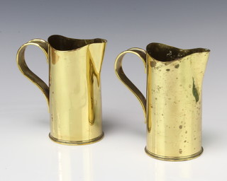 A pair of American WWI trench art jugs formed from shell cases, 1 marked 75DEC H2601 15 USA, the other ARSL 117.13S 75DEC 15cm x 8cm 