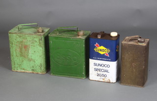 A rectangular pressed metal oil can, the base marked G.S.W 1942, an Esso pressed metal petrol can base marked Valor 2838 and 1 other metal can marked Viro 1045 with Spratts cap and a Sunoco oil can 