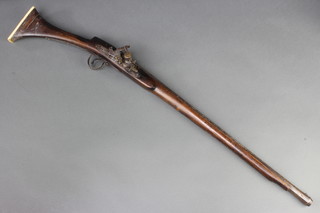 An Indian flintlock gizzelle with 54cm engraved barrel and inlaid brass and ivory stock 