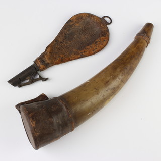 A horn and leather powder flask 29cm, a leather and steel shot flask 21cm (some corrosion to the leather) 