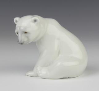 A Lladro figure of a seated polar bear cub 8cm 