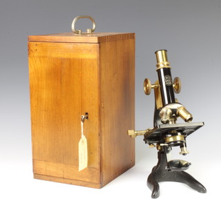 A C Baker Japanned and gilt metal single pillar microscope no.6492 complete with carrying case 
