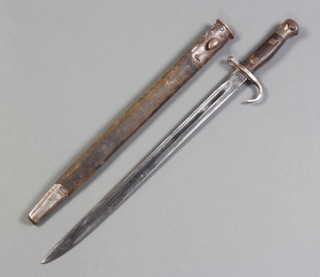 A Victorian bayonet having a 43cm blade marke with royal cypher