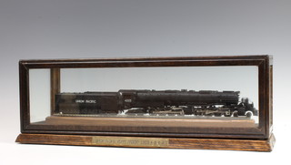 A River Rossi OO gauge model locomotive and tender, a Union Pacific heavy freight locomotive 4-8-4 in a glass case 