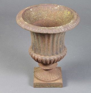 A Victorian style cast iron fluted garden urn with egg and dart border 44cm x 37cm 