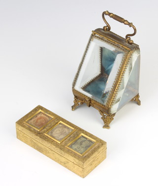 A Victorian gilt metal 3 section stamp box the lid set 3 stamps 3cm x 4cm x 3.5cm together a gilt metal and bevelled glass wedge shaped trinket box/watch case 7cm x 6cm x 6cm 