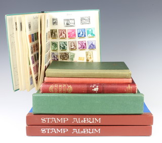 A Lord Nelson album of world stamps, a Royal Standard album of world stamps - GB, Germany, Spain, a stock book of GB Elizabeth II used stamps, an album of world stamps - China, Dominica, a green stock book of mint and world used stamps and 2 blue albums of world stamps 