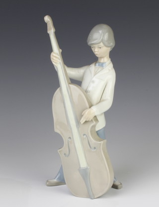 A Lladro figure of a young man playing a double base 25cm 