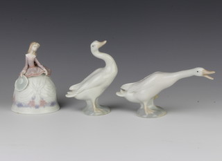 A Lladro figure of a goose 10cm, a ditto 12cm and a figural bell 12cm 