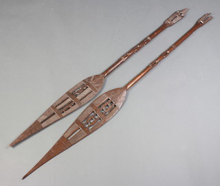 Two African carved Niger paddles 144cm l x 13cm w 