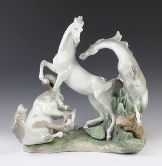 An impressive Lladro group of 3 horses playing 44cm 