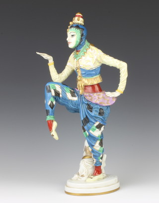 A Rosenthal figure of an exotic dancer, raised on an oval base standing beside a seated figure of Hotei 40cm 