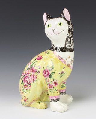 A reproduction figure of a Galle cat the yellow ground decorated with flowers 33cm 