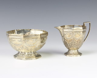 A Victorian octagonal repousse silver cream jug and sugar bowl London 1886, 200 grams 