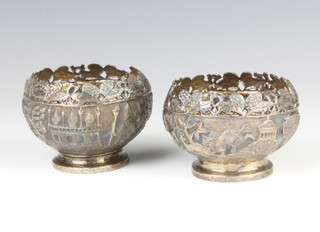 A pair of repousse Indian silver bowls decorated with animals and buildings 163 grams, 8cm 