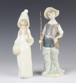 A Lladro figure of a girl in a hooded coat 22cm and a ditto of a boy fisherman 4809 23cm 