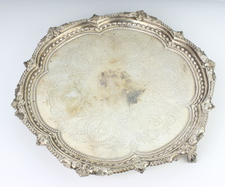 A Victorian silver salver with chased decoration and fancy rim on claw and ball feet, London 1872, 31 cm, 780 grams 