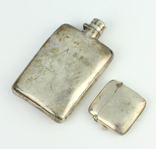 An Edwardian silver vesta Birmingham 1908 and a hip flask 129 grams