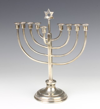 A Continental silver menorah candle holder 507 grams, 29 cm