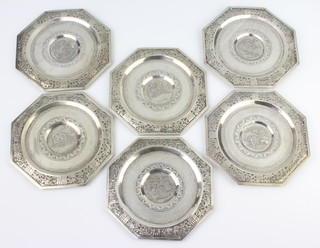 A set of 6 Chinese silver octagonal dishes decorated with farming figures enclosed in pierced bamboo borders 13cm, 342 grams