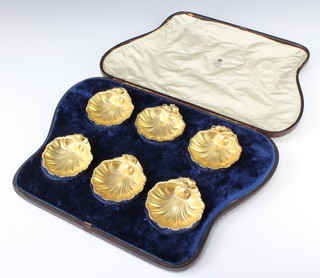 A cased set of silver gilt Faberge shell shaped table salts, the handles with entwined mice and a frog with stamped 88 head and makers mark AN, 7cm