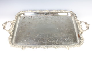 A silver plated 2 handled tray with cased scroll decoration 76cm 