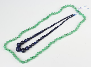 A string of lapis lazuli style graduated beads 46cm (no clasp) and a string of green glass beads 66cm