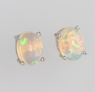 A pair of silver ethiopian opal ear studs 