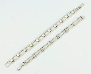 A silver flat link bracelet and 1 other bracelet, 50 grams 