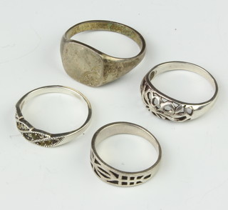 A silver signet ring size P and 3 others