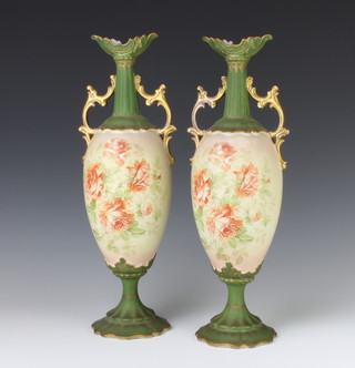 A pair of Edwardian Continental two handled vases decorated with roses 39cm 
