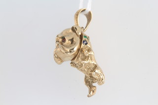 A 9ct yellow gold charm in the form of a bulldog set with gem stones 12.1 grams 