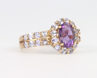A 9ct yellow gold amethyst and gem set ring 2.6 grams, size L 