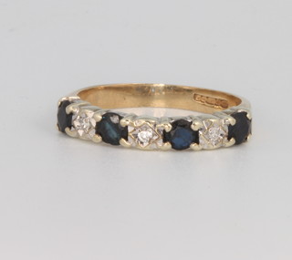 A 9ct yellow gold sapphire and diamond half eternity ring, size L 1/2 