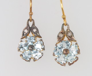A pair of silver gilt, pale blue topaz and diamond floral earrings 25mm 