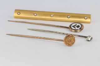An Edwardian gold tie pin, 2 others and a bar brooch 