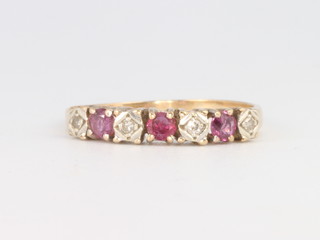 A 9ct yellow gold ruby and diamond half hoop ring 1.8 grams, size R 