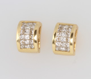 A pair of 18ct yellow gold diamond set ear studs 