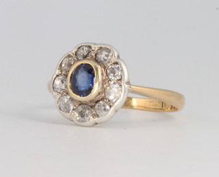 An 18ct yellow gold sapphire and diamond cluster ring, size L, 2.4 grams