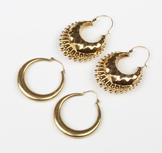 Two pairs of 9ct yellow gold hoop earrings 10.2 grams 