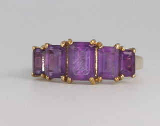 A 9ct yellow gold baguette cut amethyst ring size P 1/2 
