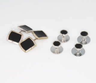 A pair of 9ct white gold onyx cufflinks and a pair of ensuite studs, together with a pair of white metal studs 